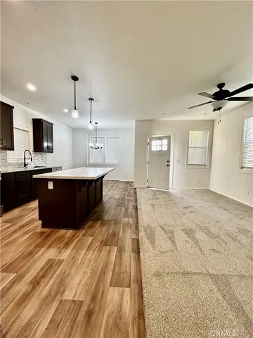 a view of kitchen with wooden floor and sink