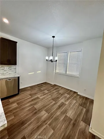 a view of a kitchen with a sink and a microwave