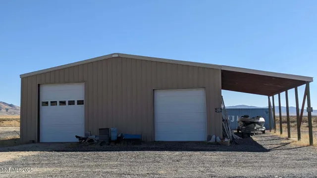 a black and white house with wooden floor