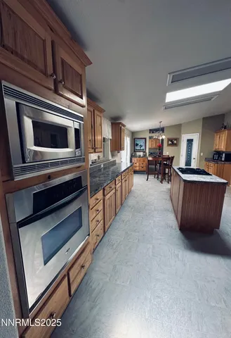 a kitchen with sink and cabinets