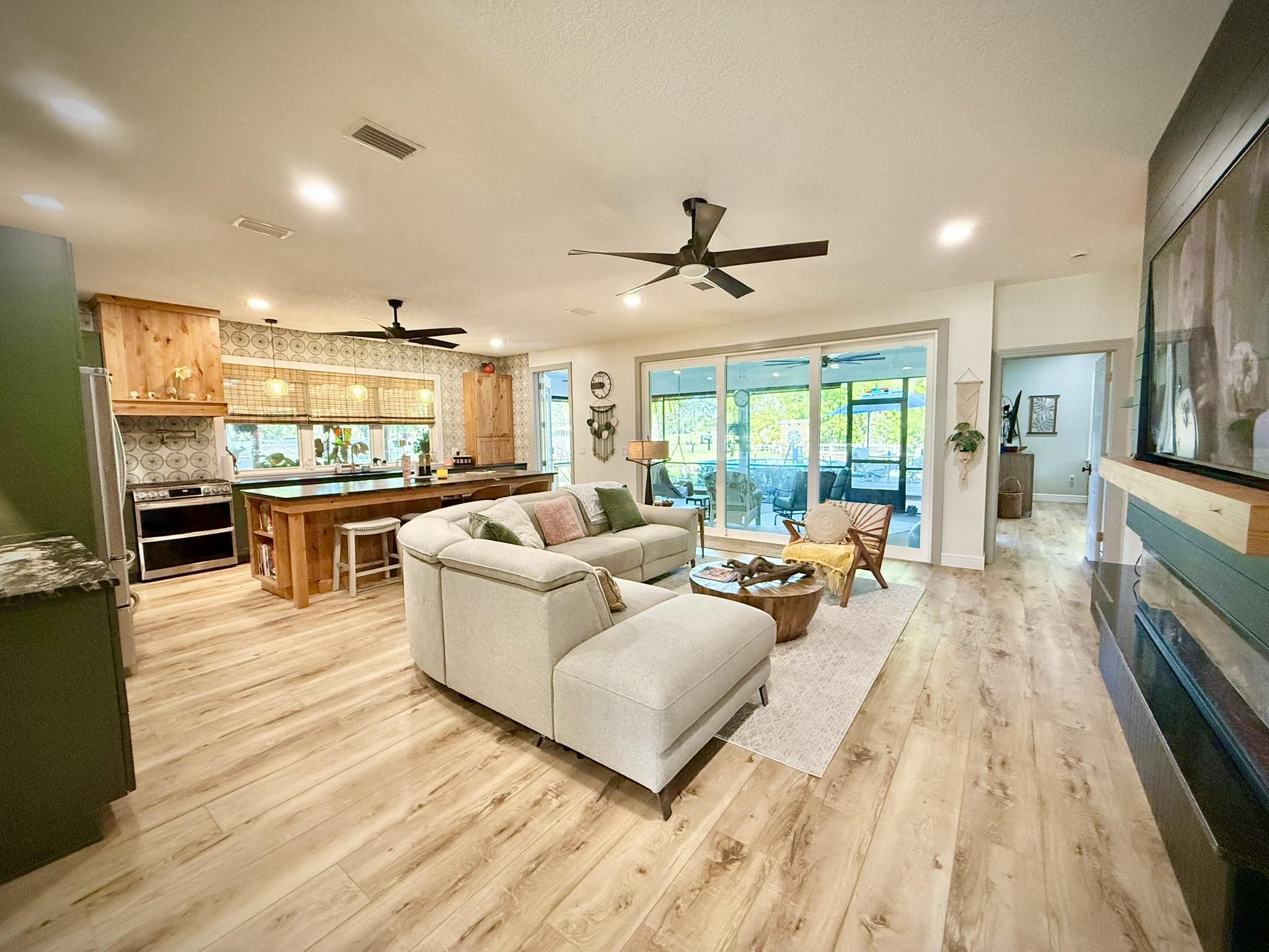 146 Maple Tree Lane Elkton, FL 32033 - Photo 11 of 75 a living room with furniture and a large window