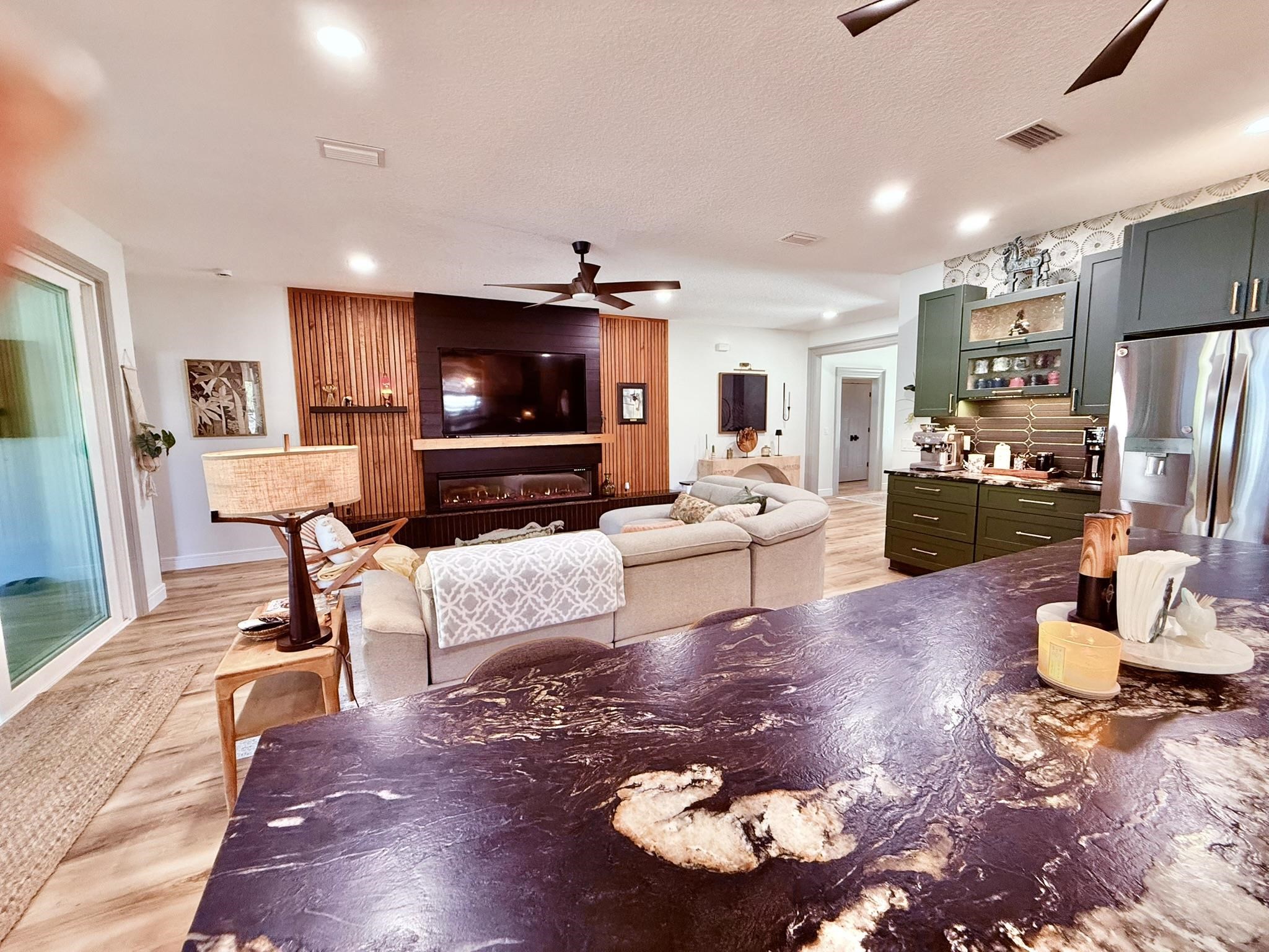 146 Maple Tree Lane Elkton, FL 32033 - Photo 12 of 75 a living room with fireplace furniture and a flat screen tv