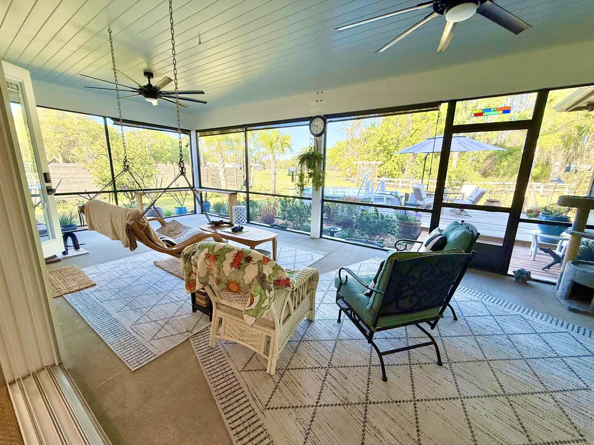 146 Maple Tree Lane Elkton, FL 32033 - Photo 16 of 75 a living room with furniture and a large window