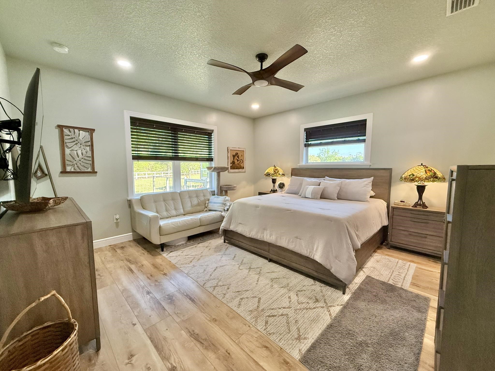 146 Maple Tree Lane Elkton, FL 32033 - Photo 23 of 75 a bedroom with a bed and a couch