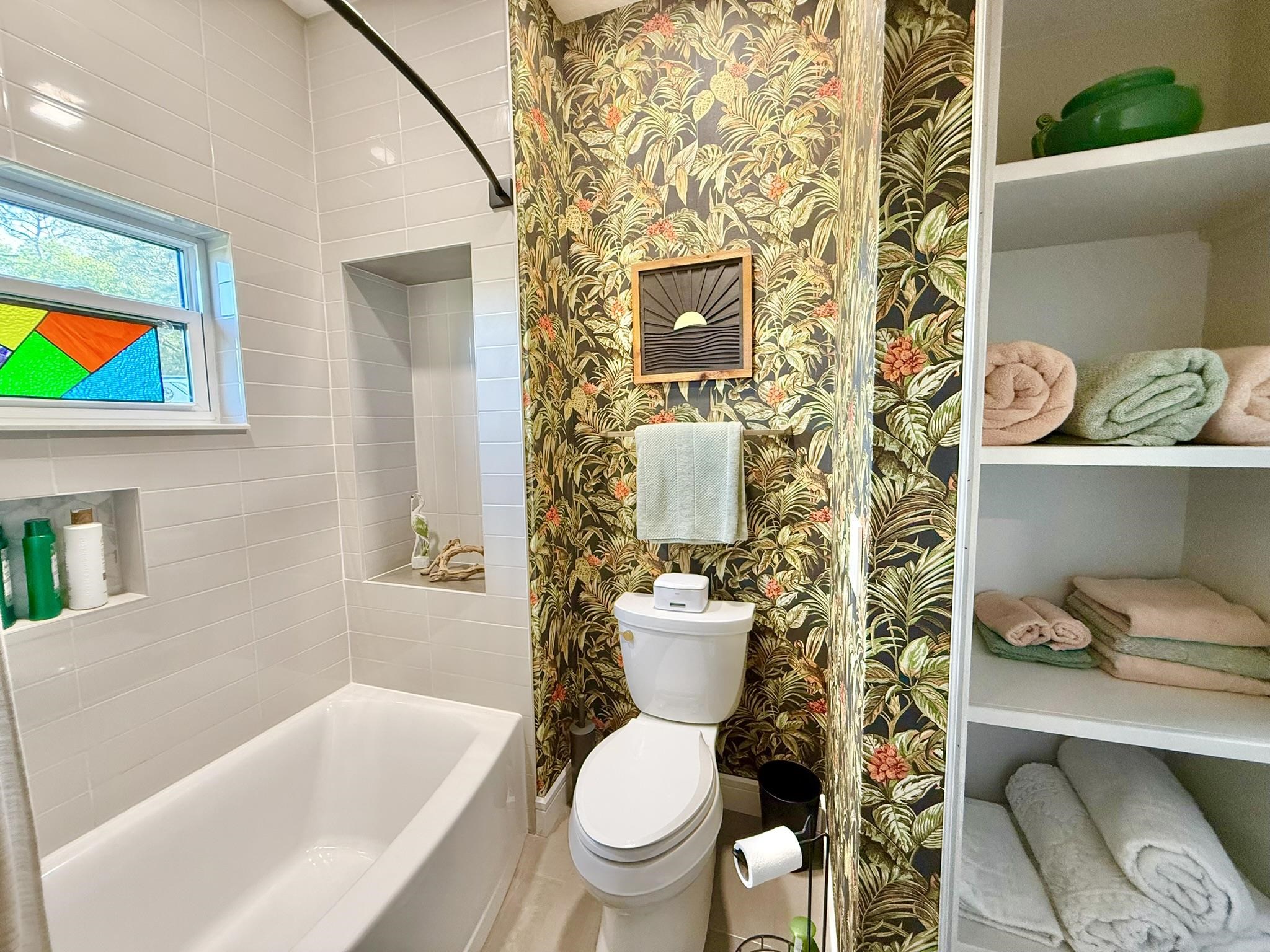 146 Maple Tree Lane Elkton, FL 32033 - Photo 32 of 75 a white toilet sitting next to a bathroom sink and tub