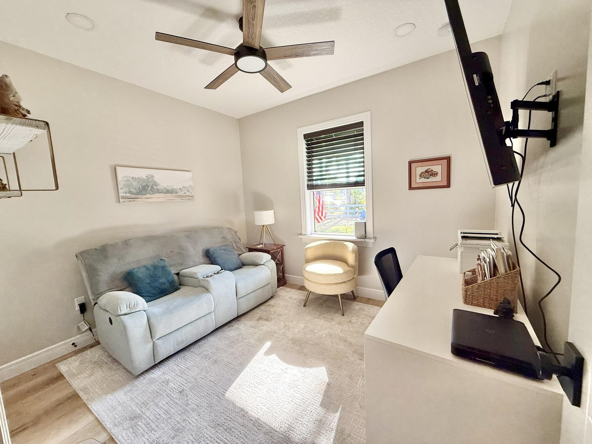 146 Maple Tree Lane Elkton, FL 32033 - Photo 34 of 75 a living room with furniture and a flat screen tv