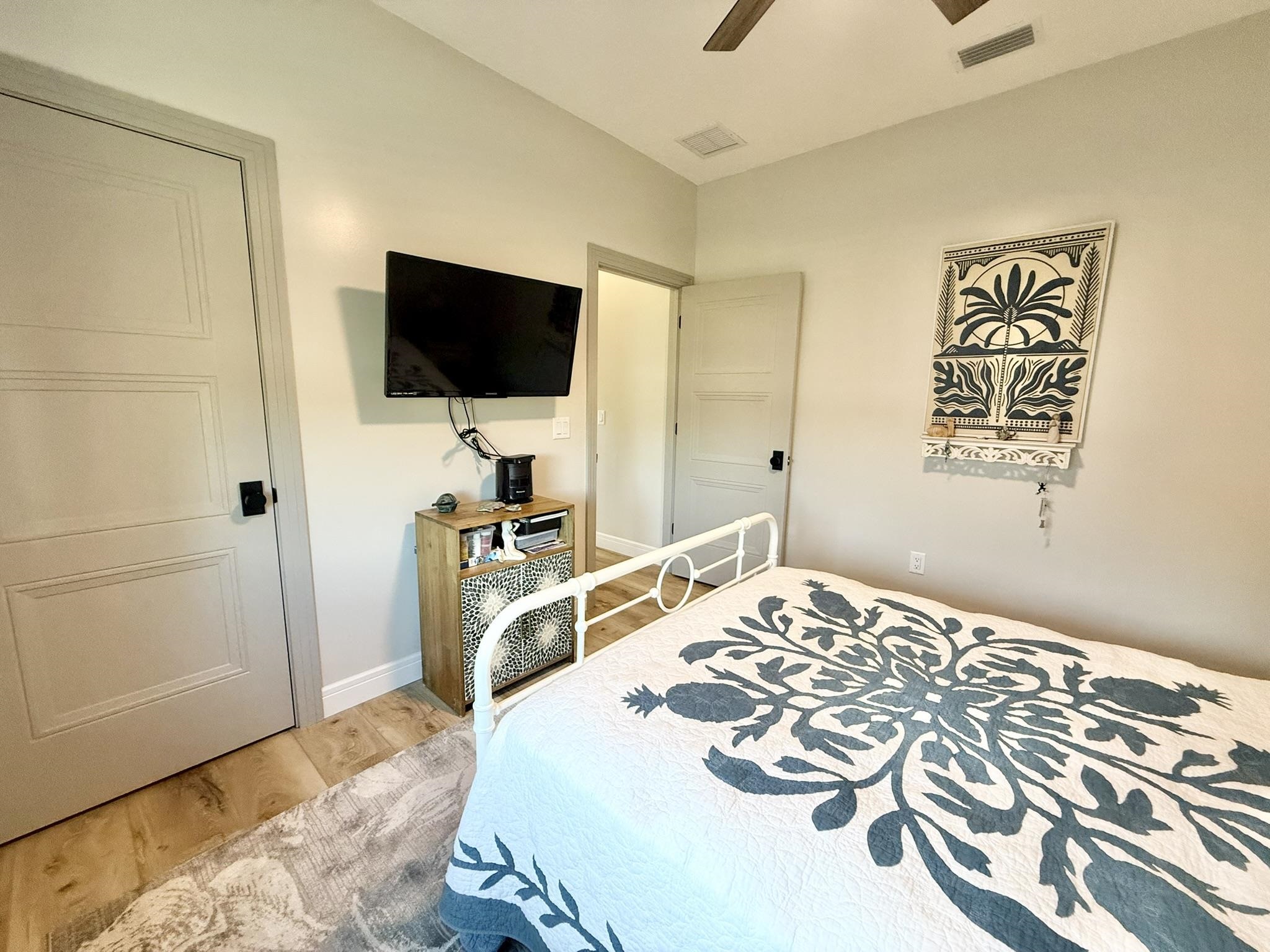 146 Maple Tree Lane Elkton, FL 32033 - Photo 37 of 75 a bedroom with a bed and a flat screen tv