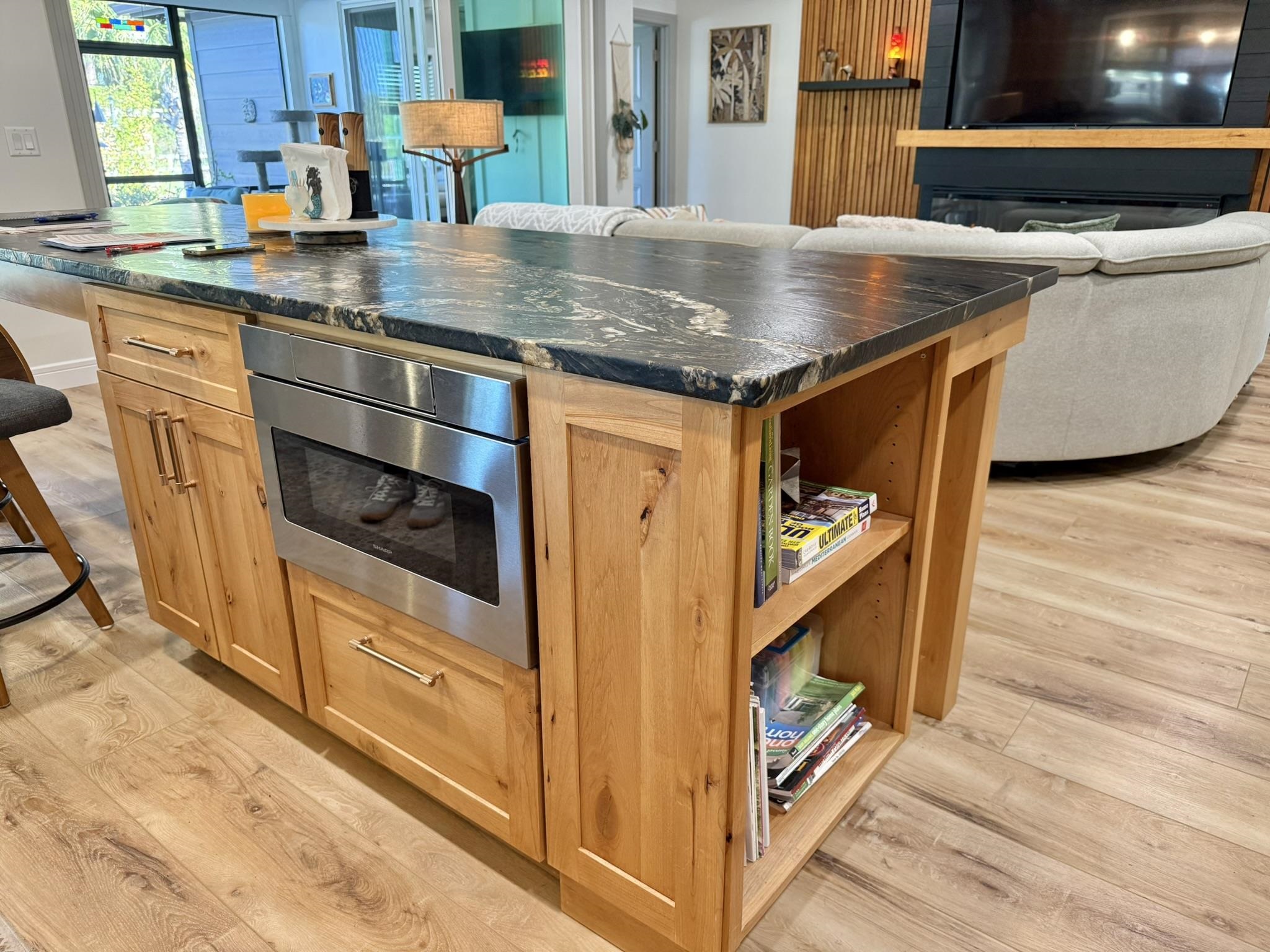 146 Maple Tree Lane Elkton, FL 32033 - Photo 44 of 75 a kitchen with stainless steel appliances granite countertop a stove and a wooden floor