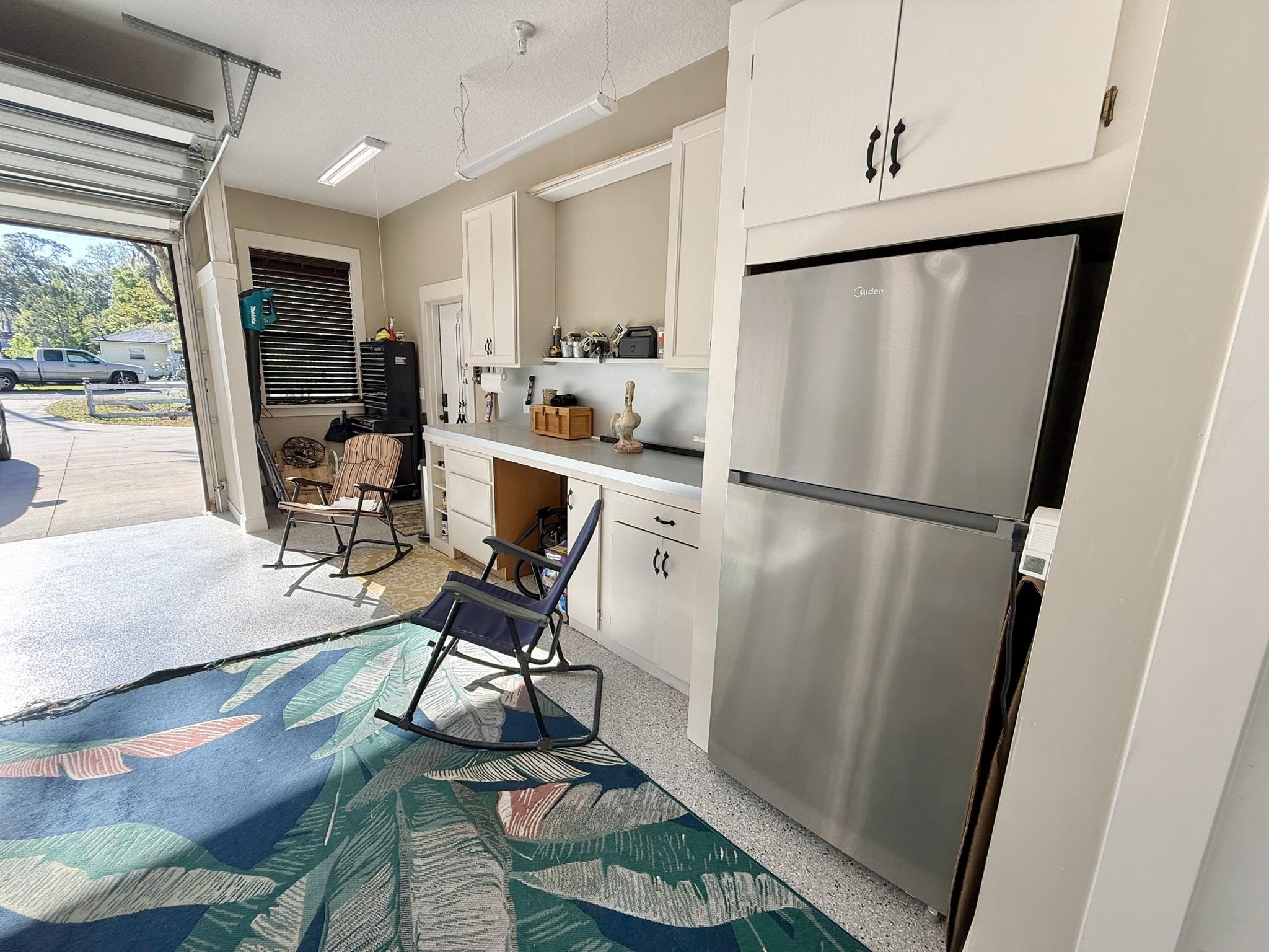 146 Maple Tree Lane Elkton, FL 32033 - Photo 50 of 75 a view of a kitchen with refrigerator and wooden floor