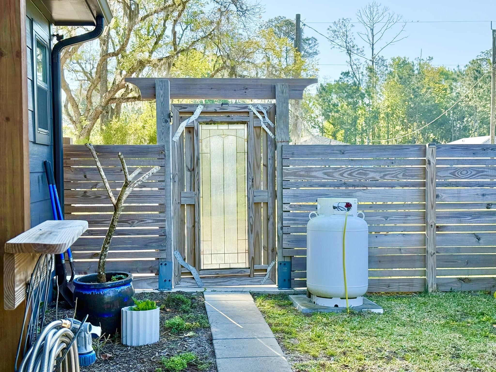 146 Maple Tree Lane Elkton, FL 32033 - Photo 57 of 75 a front view of a house with garden