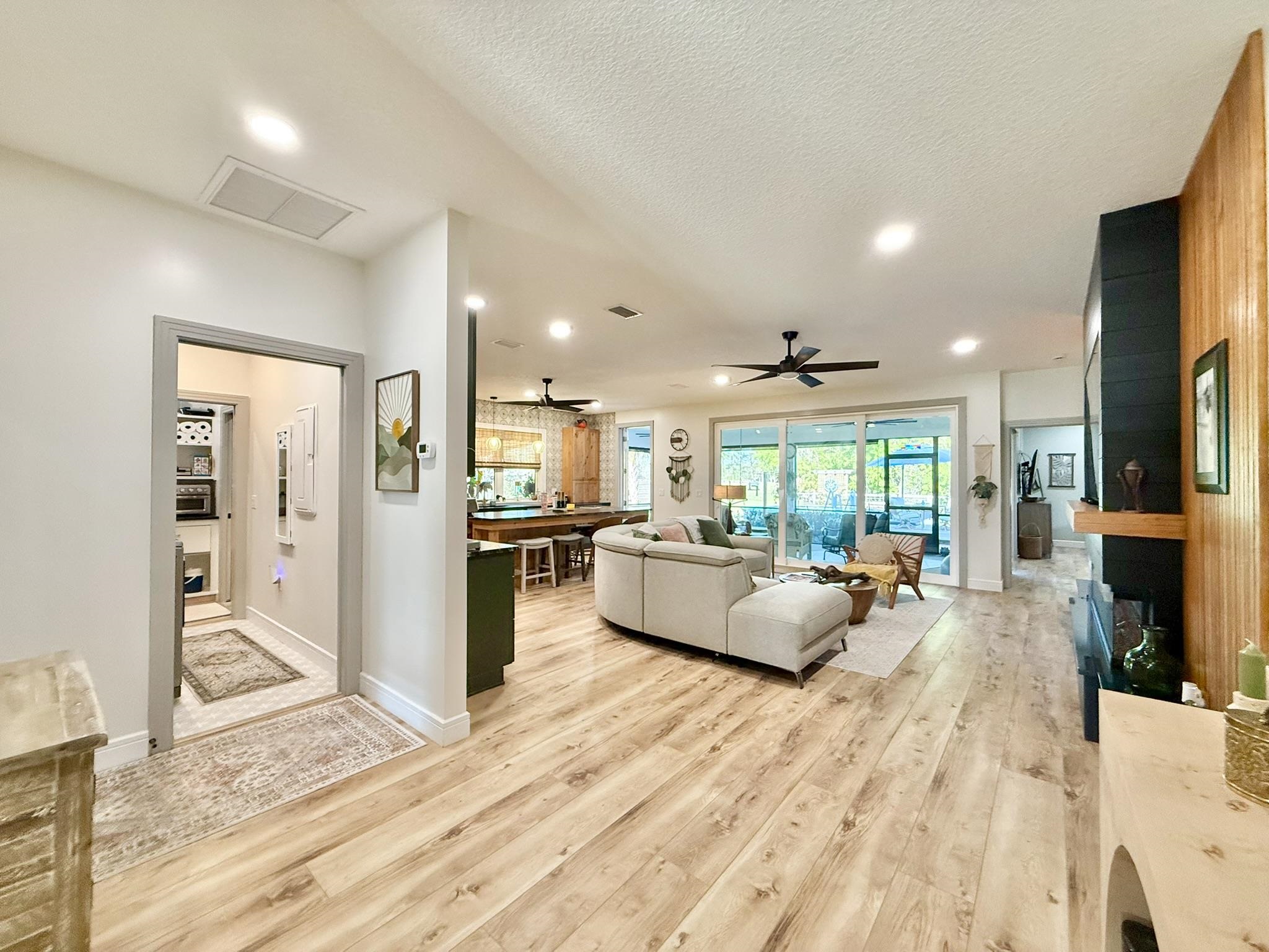 146 Maple Tree Lane Elkton, FL 32033 - Photo 10 of 75 a living room with furniture and a wooden floor