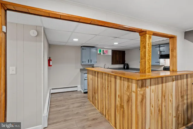 a view of a patio with wooden floor and fence