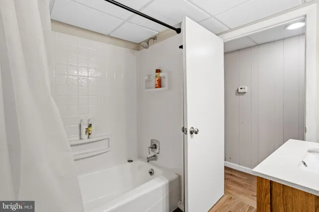 a bathroom with a bathtub and a shower