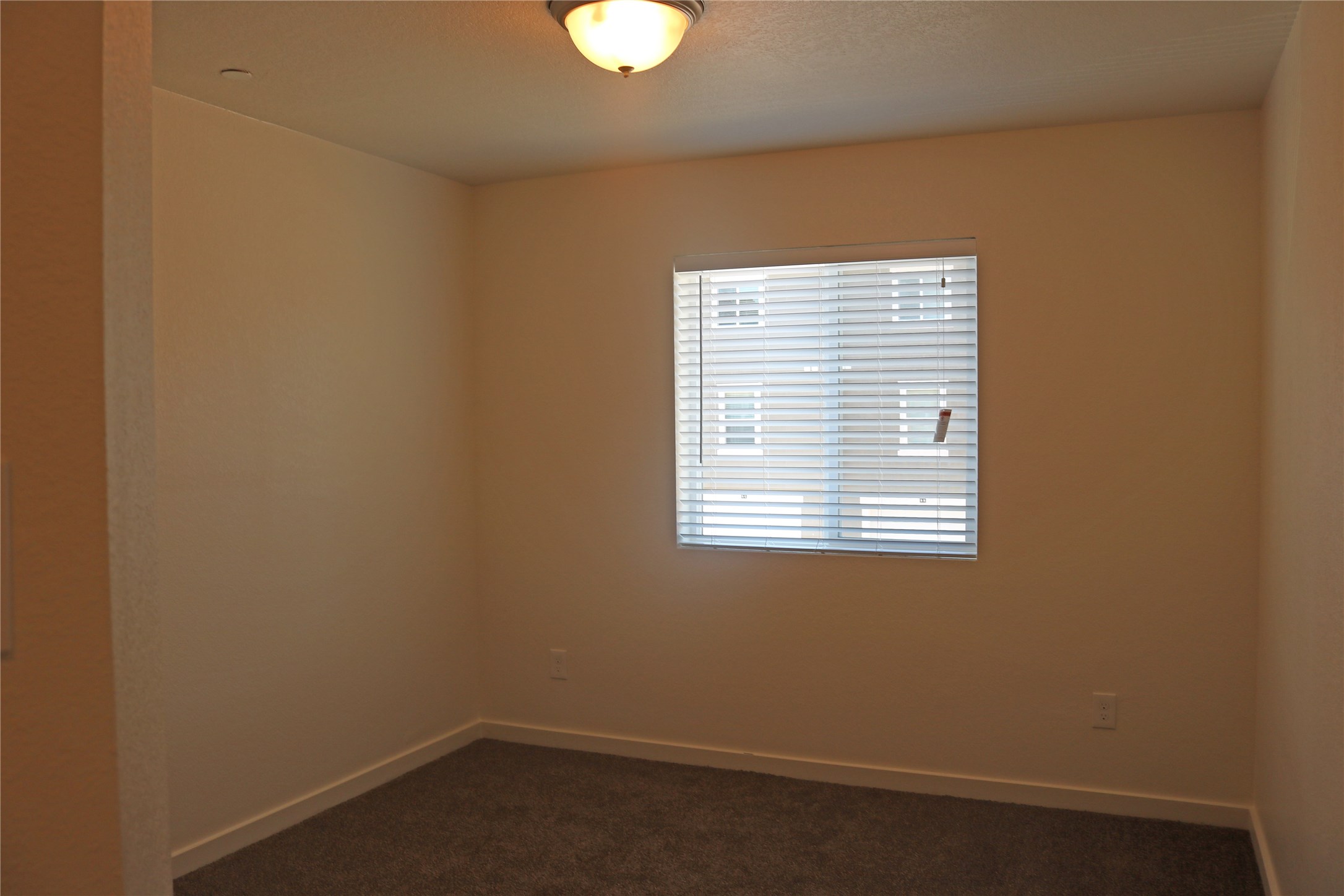 10535 Mills Road, Unit 3A Houston, TX 77070 - Photo 13 of 50 a view of an empty room with a window
