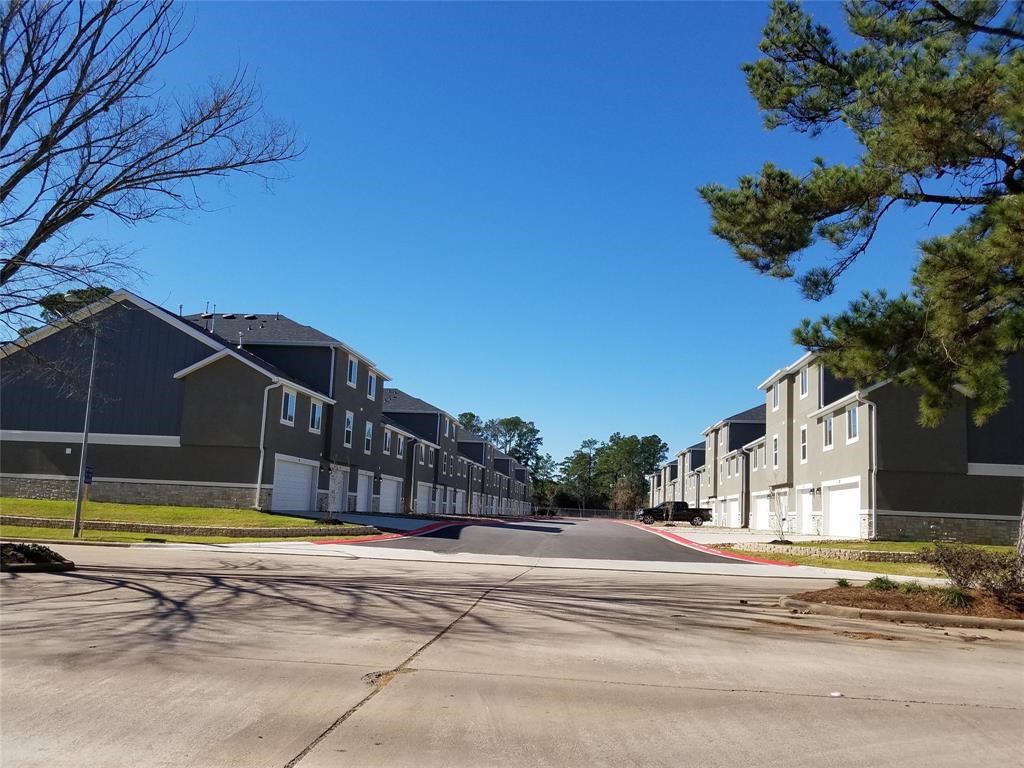 10535 Mills Road, Unit 3A Houston, TX 77070 - Photo 2 of 50 a view of a house with swimming pool and a yard
