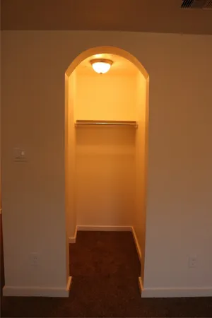 a white toilet sitting next to a bath tub