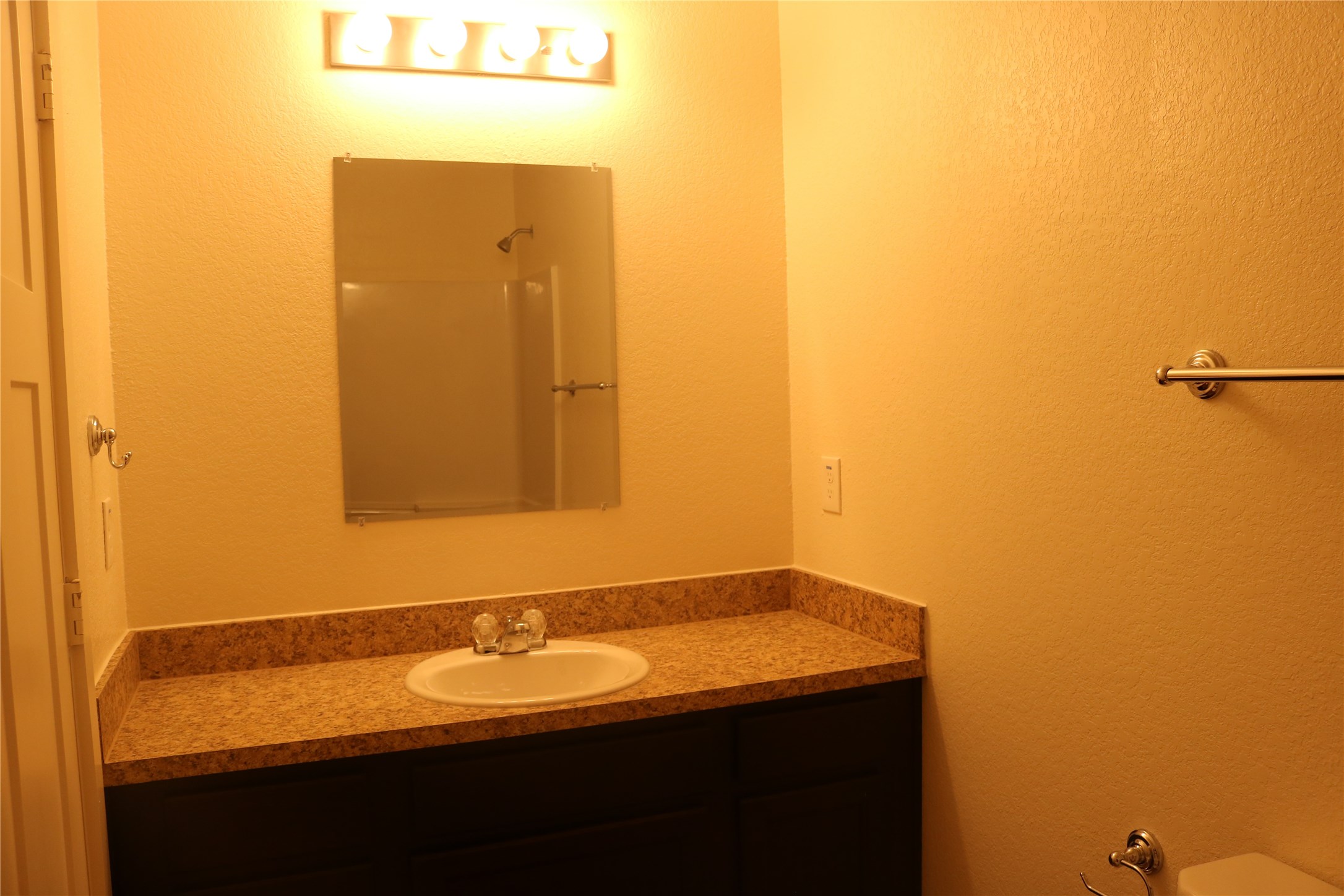 10535 Mills Road, Unit 3A Houston, TX 77070 - Photo 29 of 50 a bathroom with a sink and a mirror