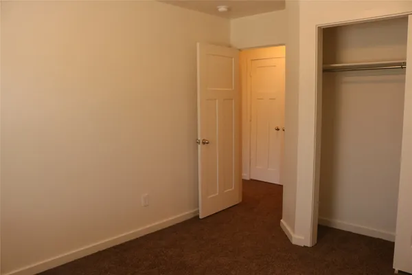 view of an empty room with wooden floor
