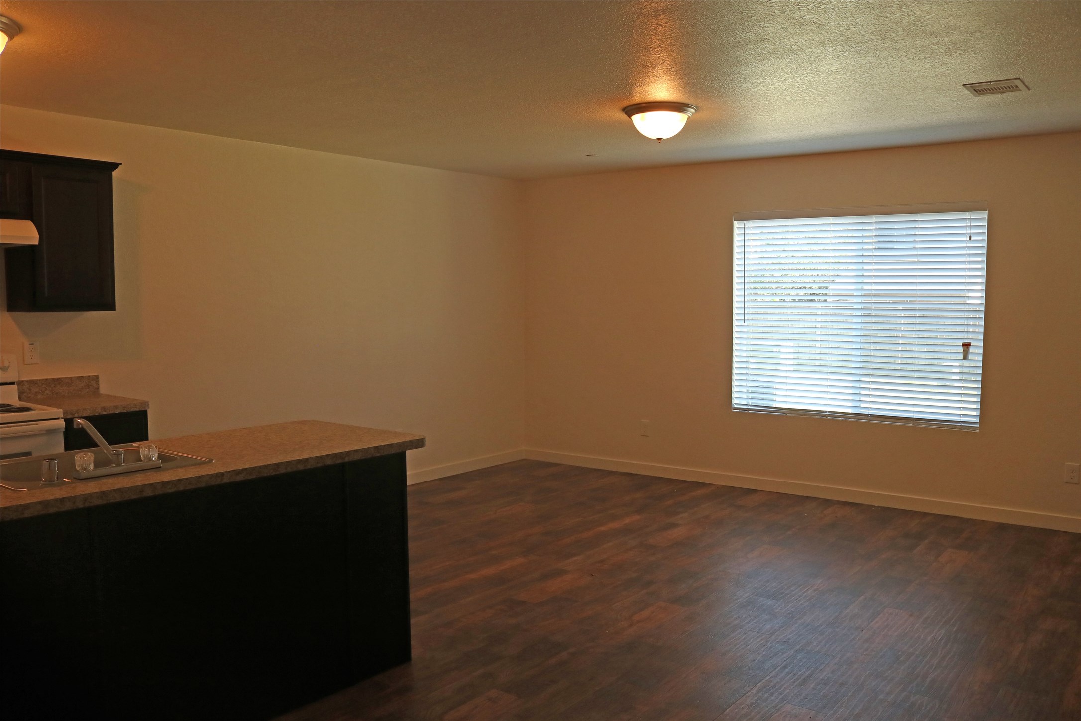 10535 Mills Road, Unit 3A Houston, TX 77070 - Photo 5 of 50 a room with a wooden floor and a window
