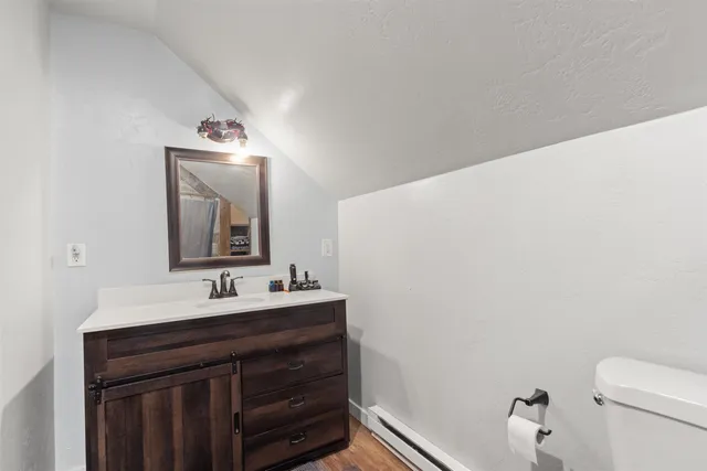 a bathroom with a sink vanity and a mirror