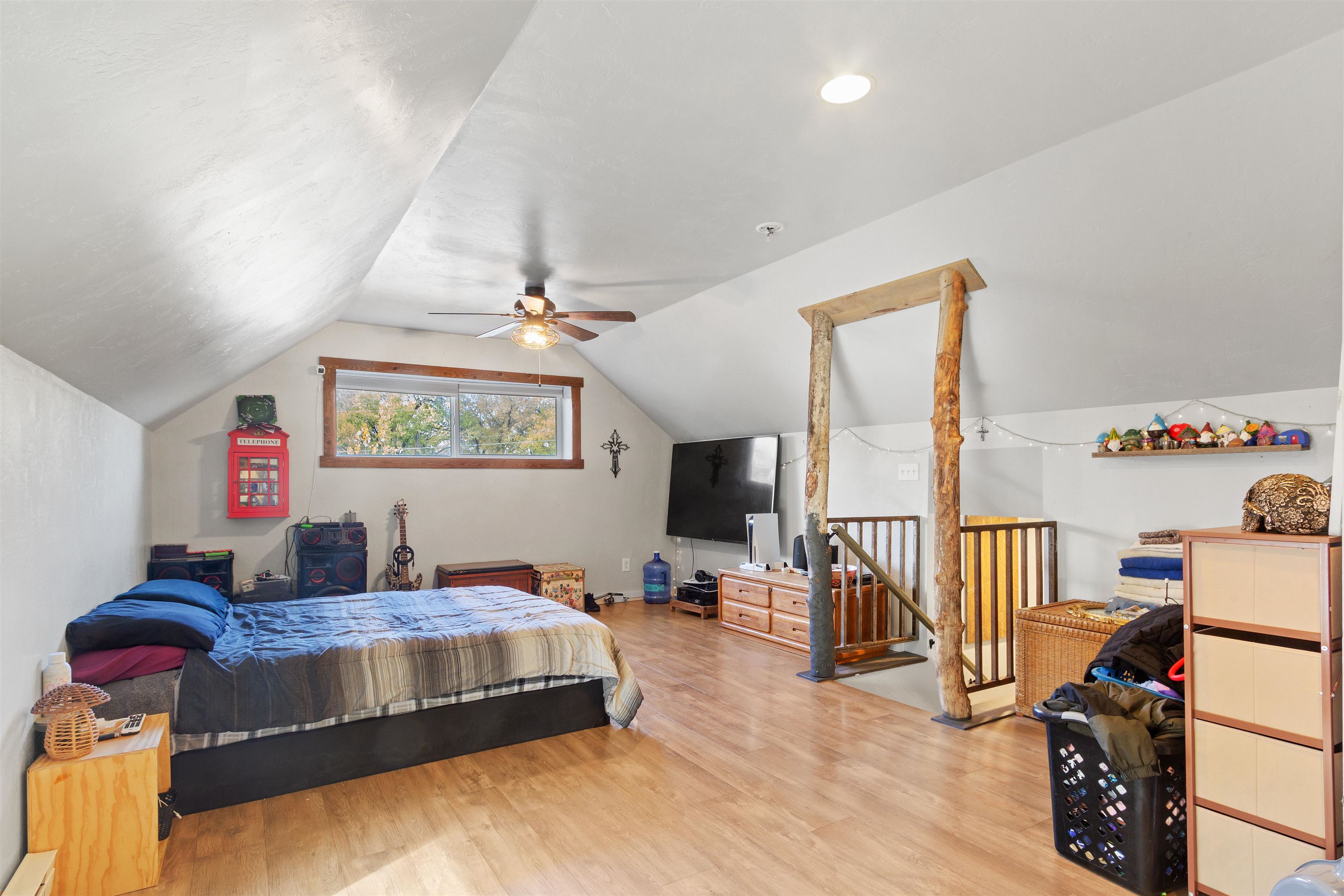 701 Highway 50 Delta, CO 81416 - Photo 15 of 31 a bedroom with a bed and wooden floor
