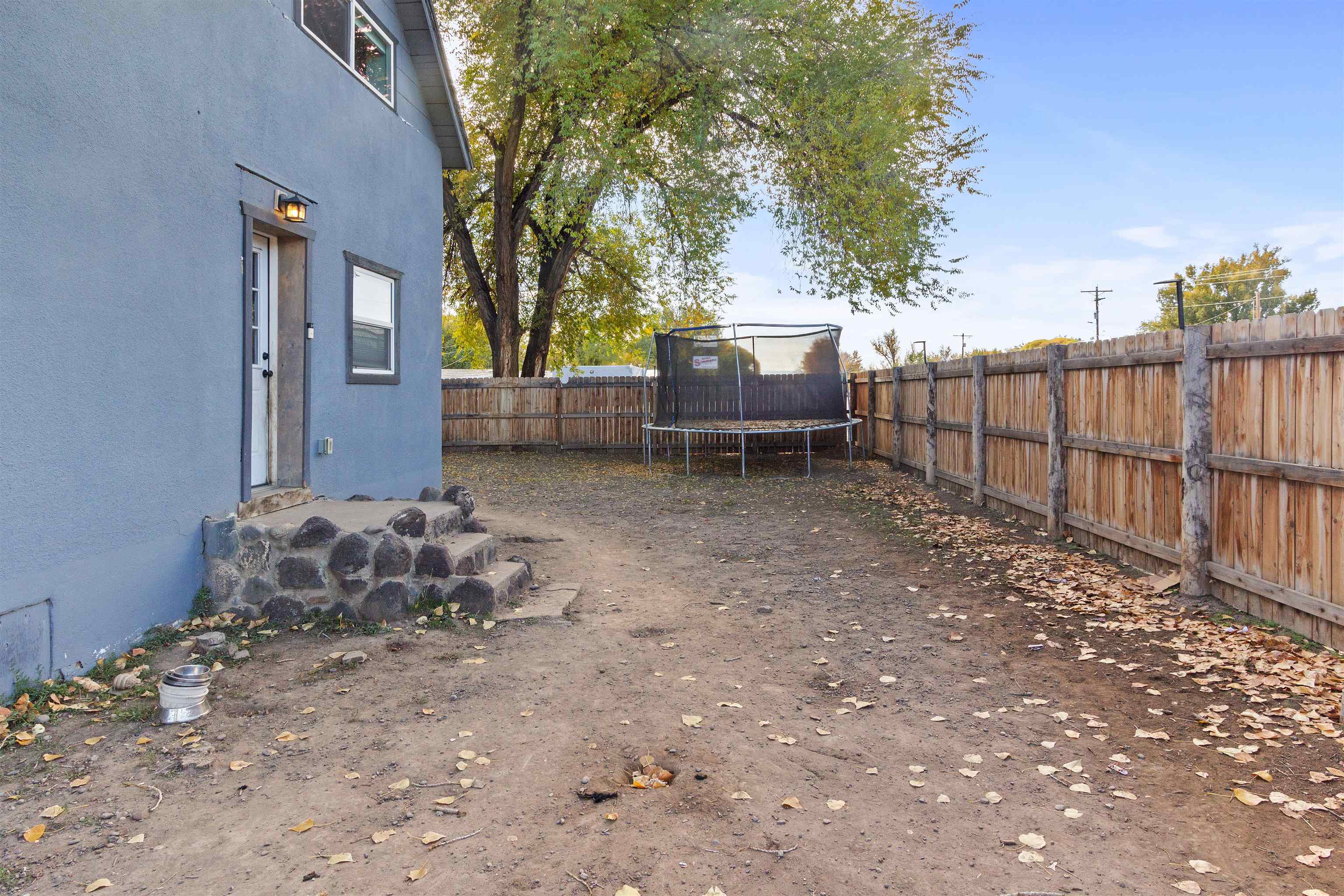 701 Highway 50 Delta, CO 81416 - Photo 27 of 31 a backyard of a house with table and chairs