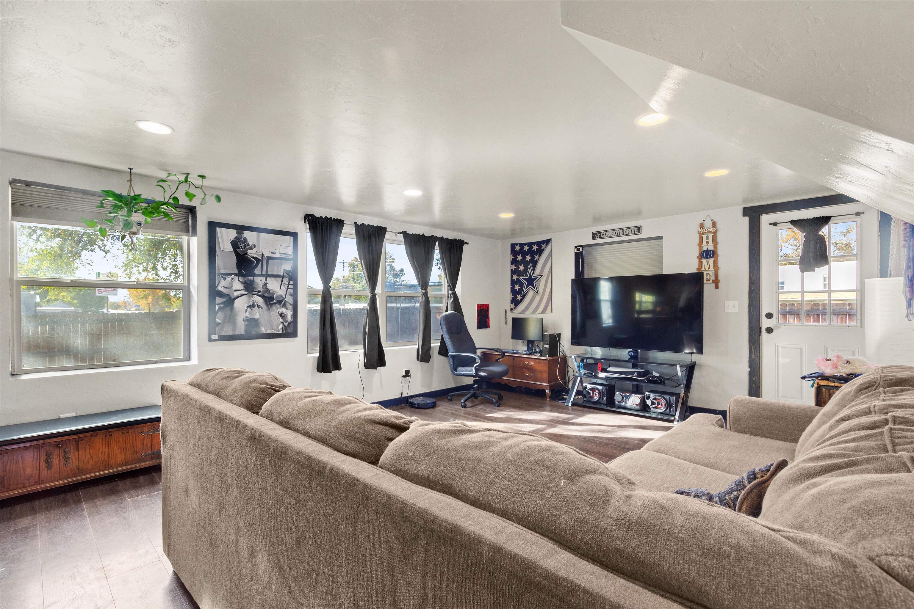 701 Highway 50 Delta, CO 81416 - Photo 9 of 31 a living room with furniture and a flat screen tv