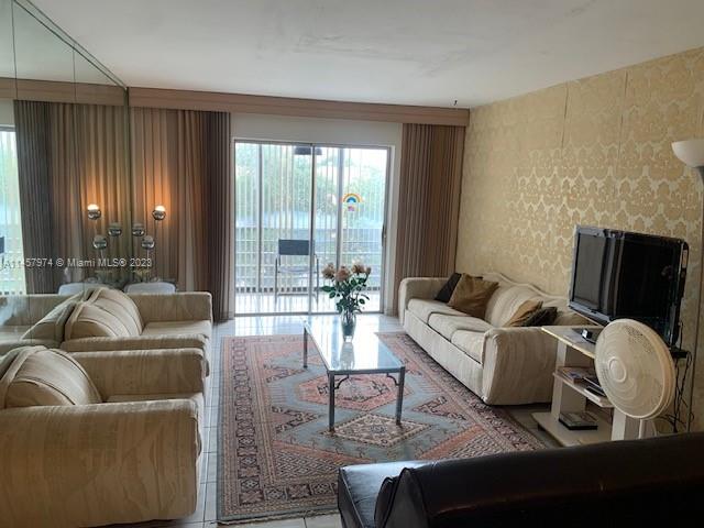 Hialeah Hialeah, FL 33012 - Photo 11 of 18 a living room with furniture and large windows