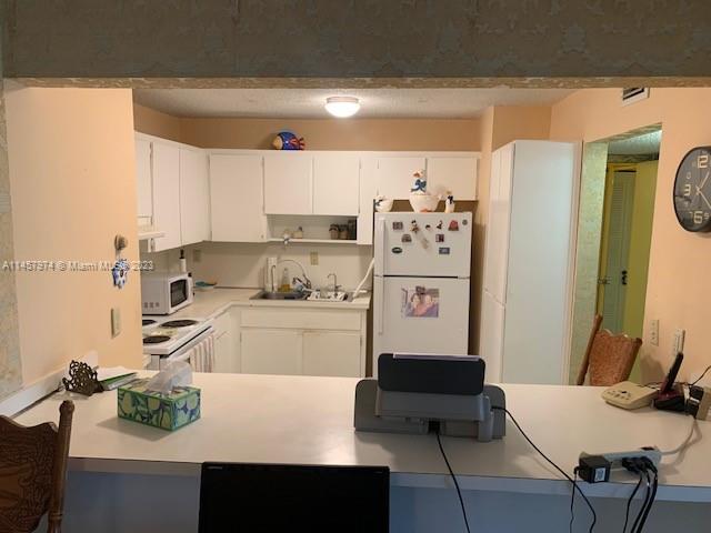 Hialeah Hialeah, FL 33012 - Photo 12 of 18 a kitchen with stainless steel appliances a refrigerator and a stove top oven