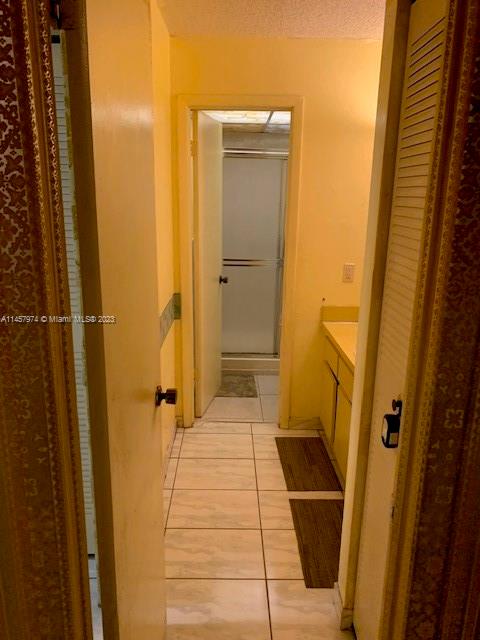Hialeah Hialeah, FL 33012 - Photo 17 of 18 a view of bathroom with a shower and a door