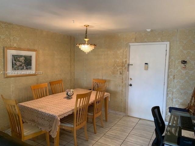 Hialeah Hialeah, FL 33012 - Photo 10 of 18 a view of a dining room with furniture and wooden floor