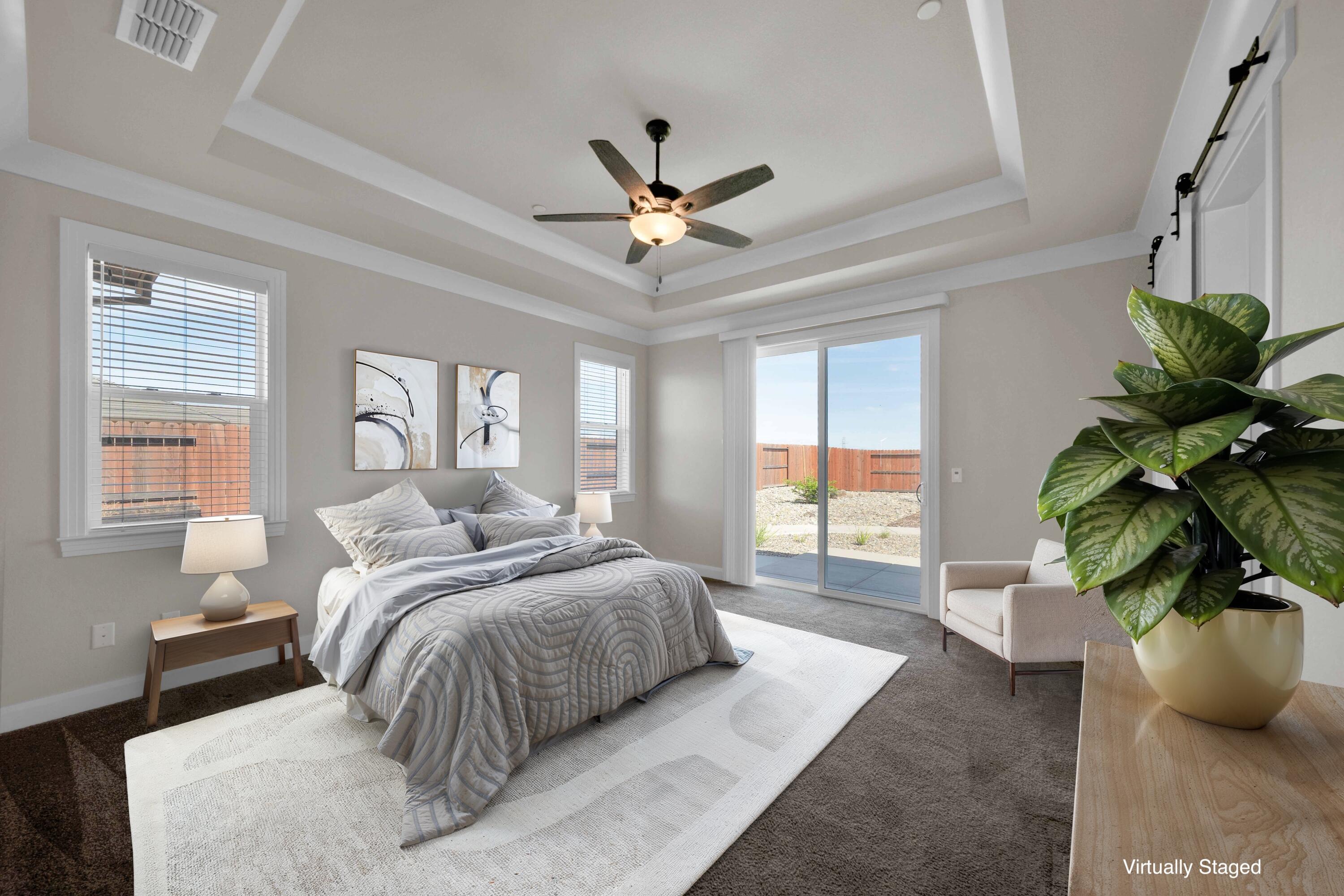 4771 Lower Springs Road Redding, CA 96001 - Photo 15 of 34 a bedroom with a large bed and a potted plant