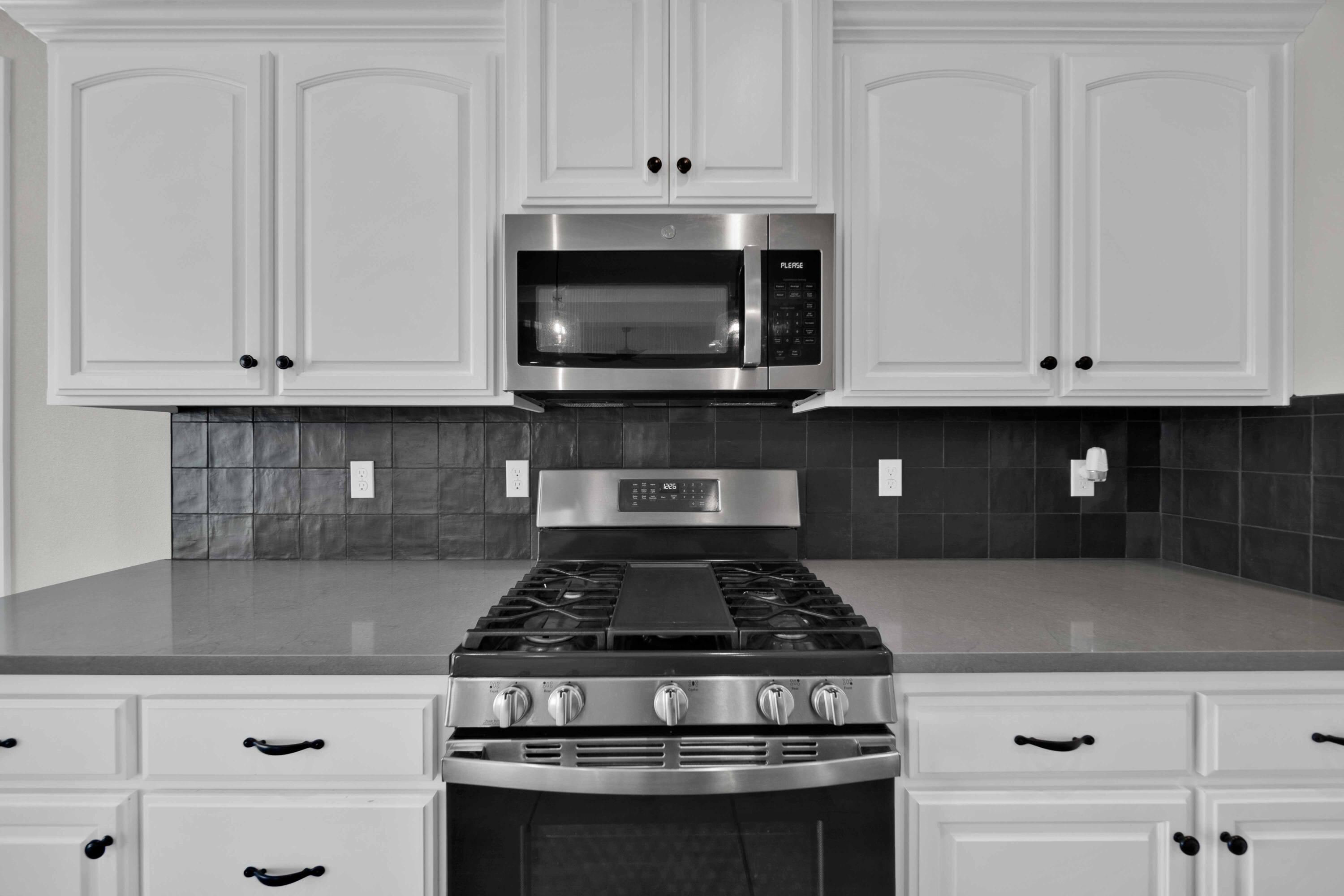 4771 Lower Springs Road Redding, CA 96001 - Photo 7 of 34 a stove top oven sitting inside of a kitchen