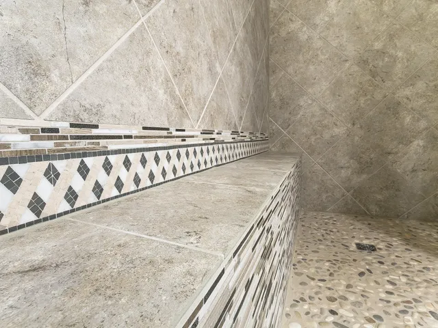 an empty room with a mirror and a ceiling fan