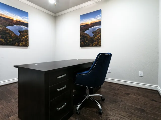 a workspace with furniture and lamp on dresser