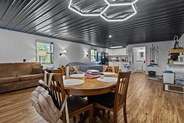 a kitchen with stainless steel appliances a refrigerator sink and cabinets