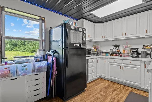 a kitchen with white cabinets and a sink