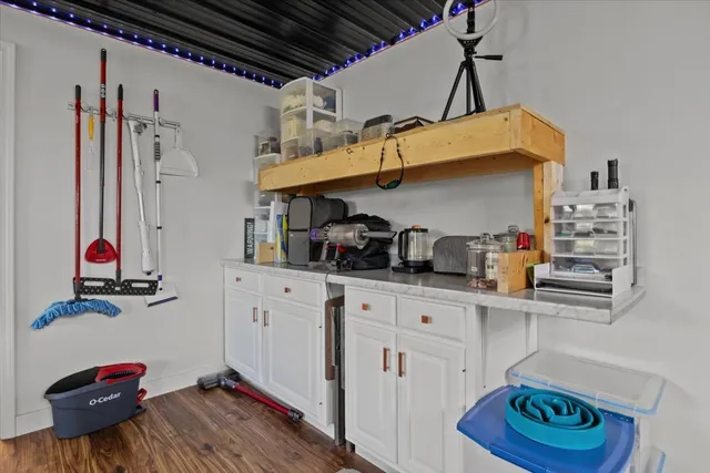 a bedroom with furniture and a wooden floor