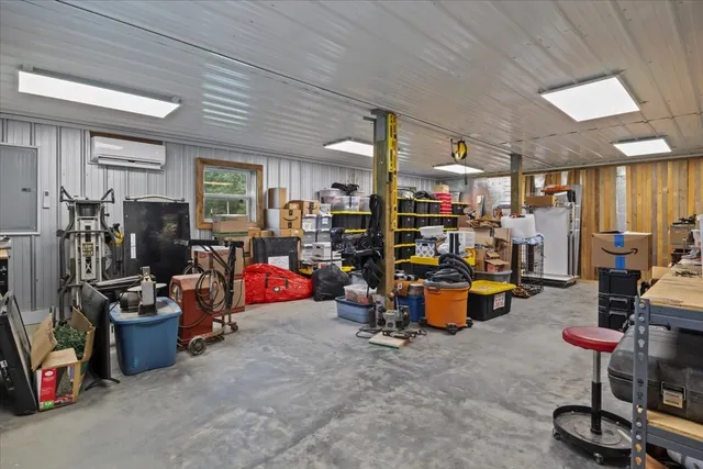a utility room with lots of clutter and cabinets