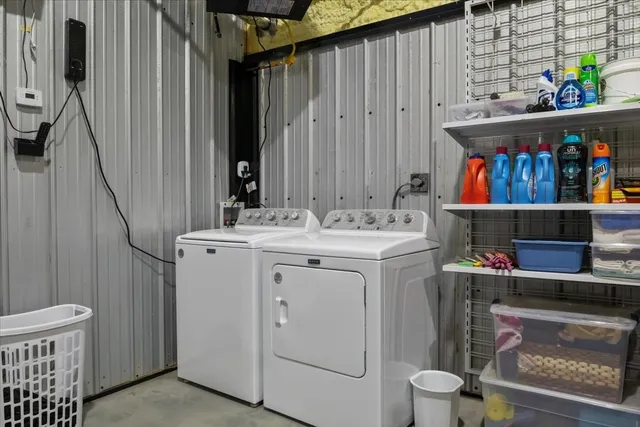 a view of a lake with a table and chairs