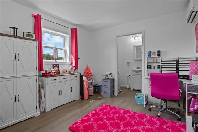 a backyard of a house with table and chairs