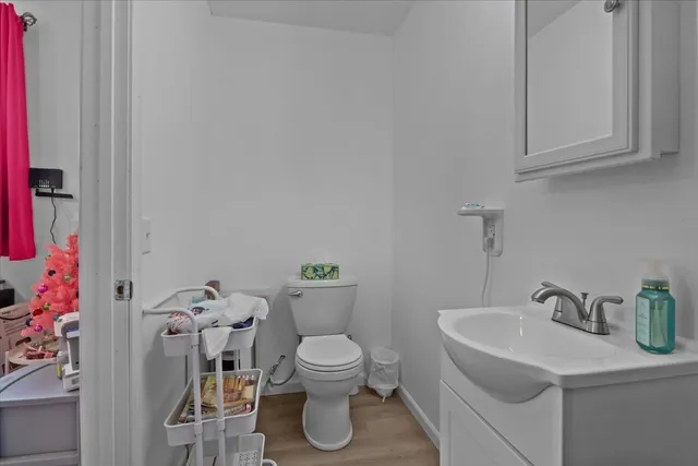 a wooden bench sitting in middle of a field