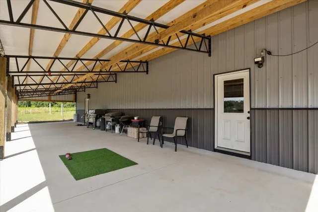 a living room with lots of furniture and clothes