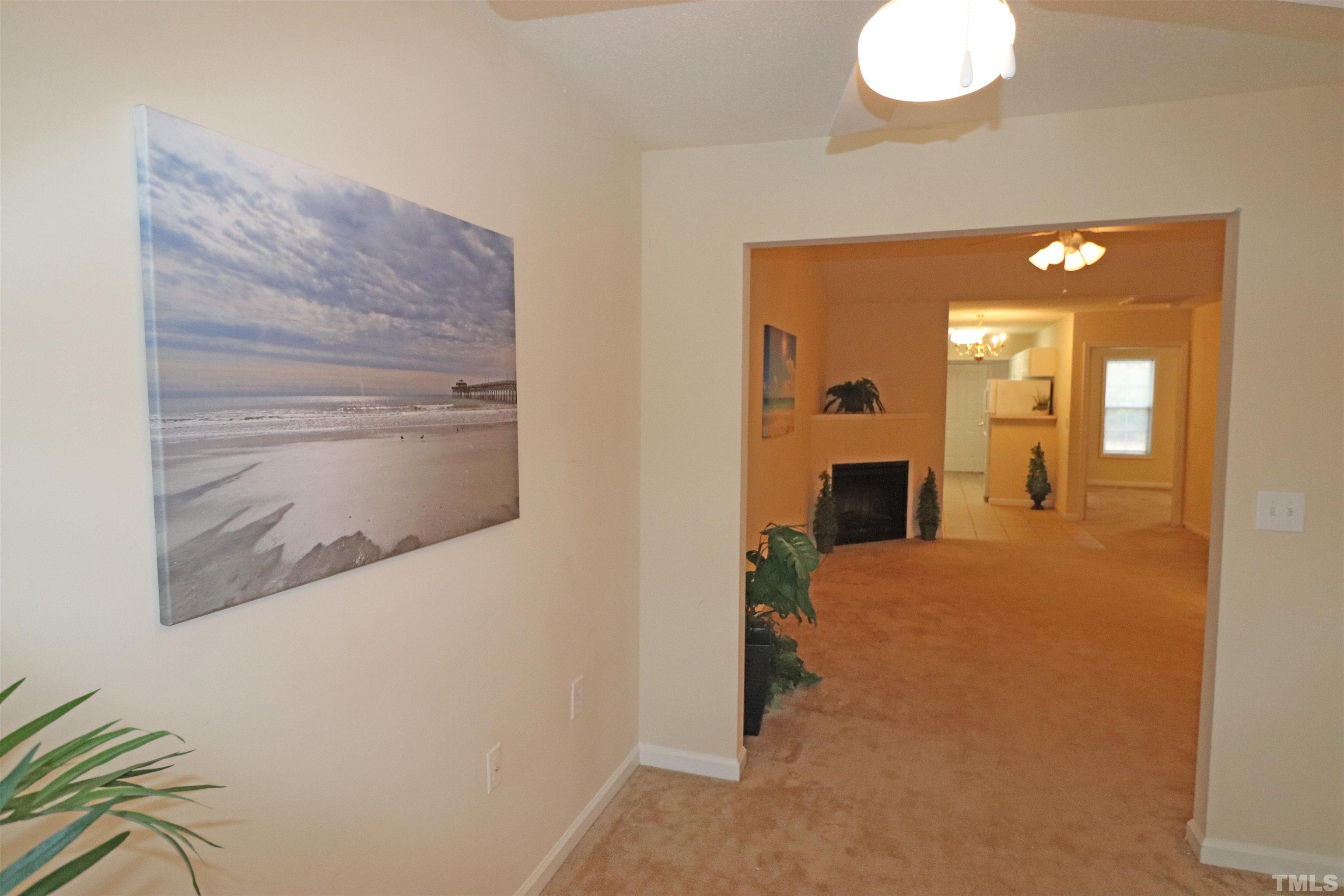 11301 Clubhaven Place, Unit 102 Raleigh, NC 27617 - Photo 13 of 53 a view of a room with wooden floor and staircase