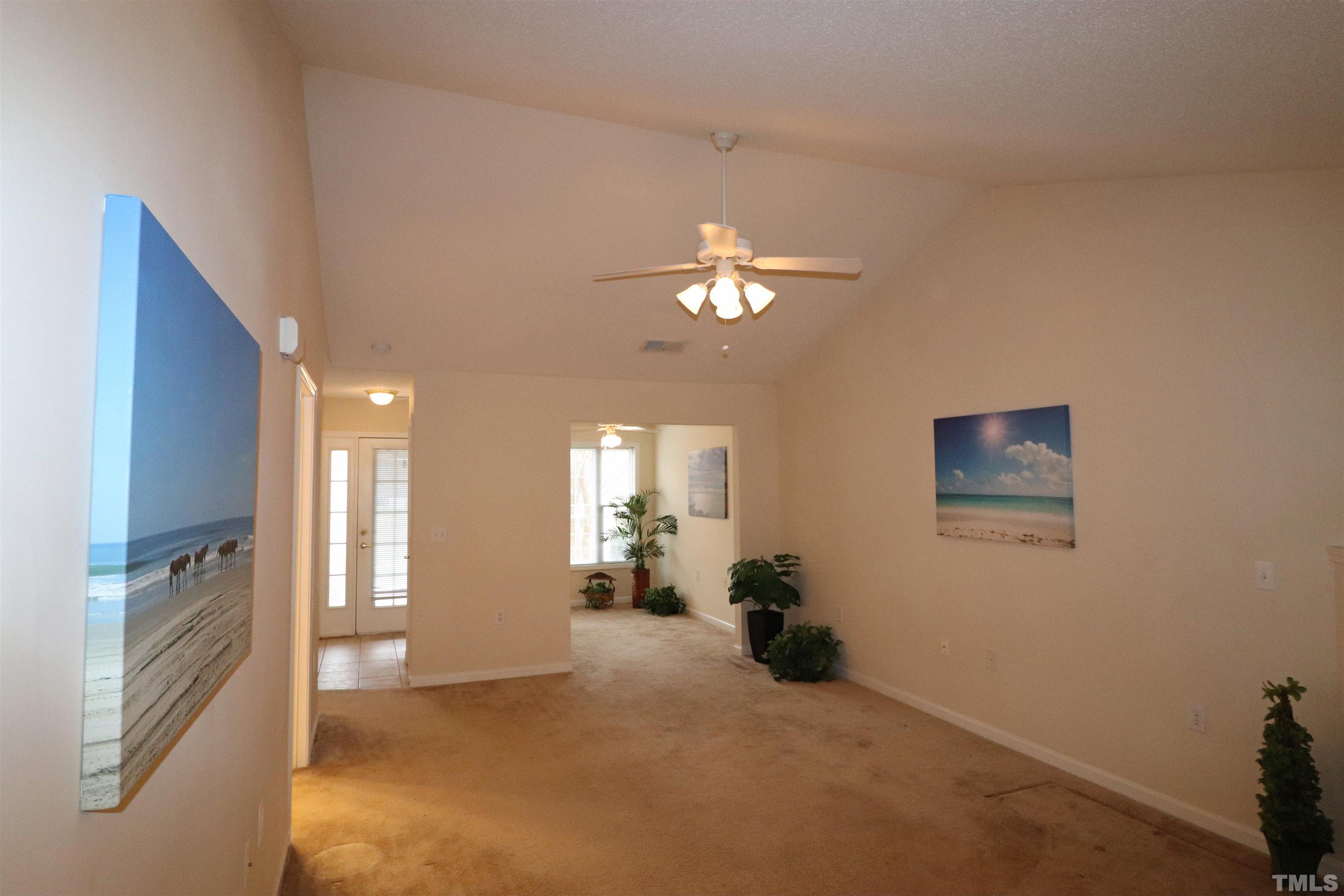 11301 Clubhaven Place, Unit 102 Raleigh, NC 27617 - Photo 21 of 53 a view of a livingroom with furniture and chandelier