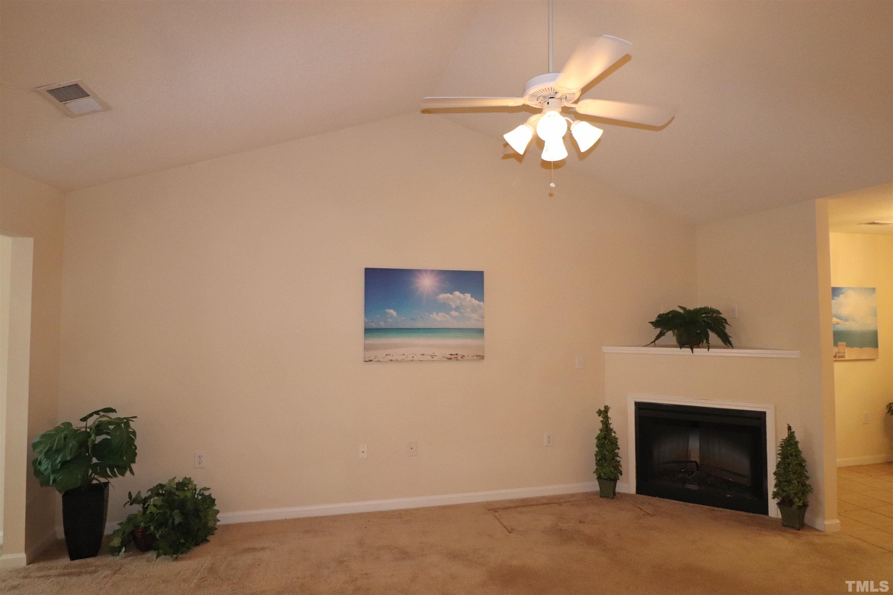 11301 Clubhaven Place, Unit 102 Raleigh, NC 27617 - Photo 23 of 53 a room with a fireplace and a window