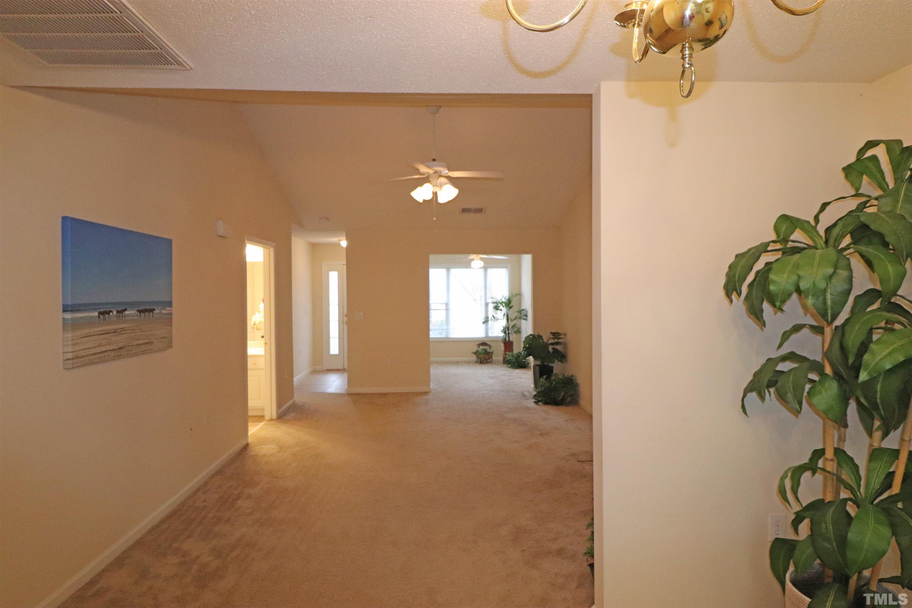 11301 Clubhaven Place, Unit 102 Raleigh, NC 27617 - Photo 24 of 53 a view of a hallway with wooden floor