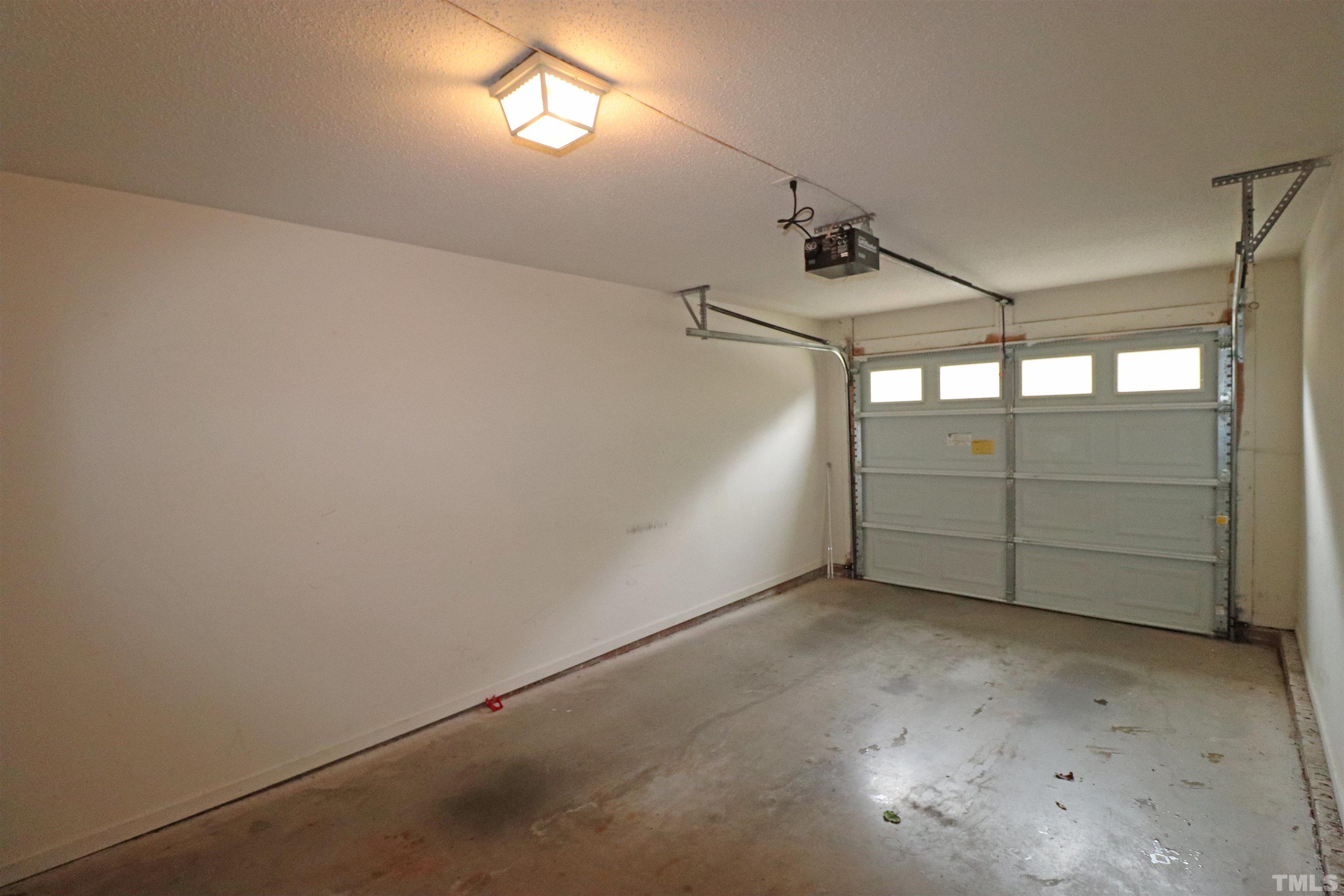 11301 Clubhaven Place, Unit 102 Raleigh, NC 27617 - Photo 30 of 53 an empty room with windows