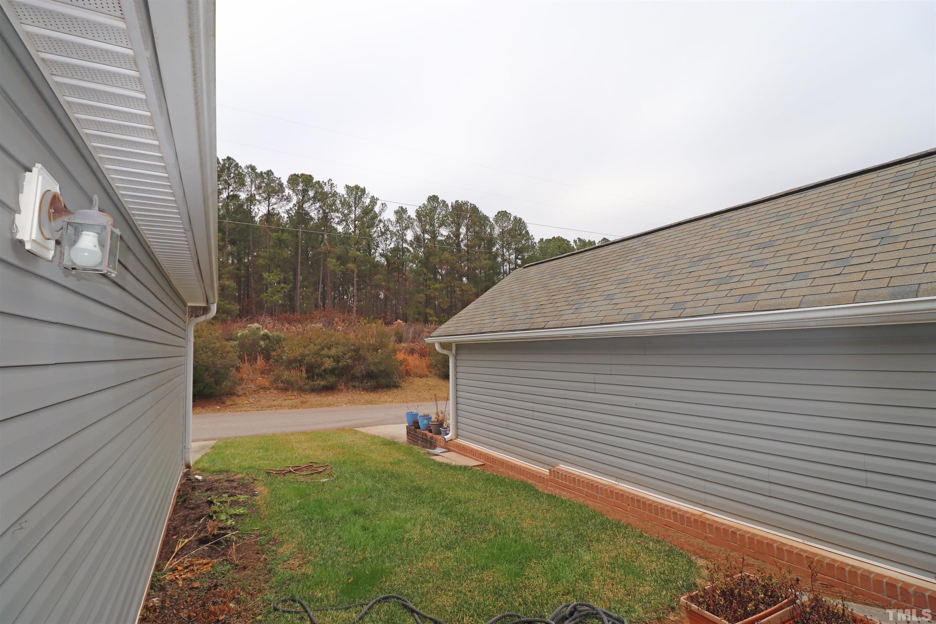 11301 Clubhaven Place, Unit 102 Raleigh, NC 27617 - Photo 32 of 53 a backyard of a house
