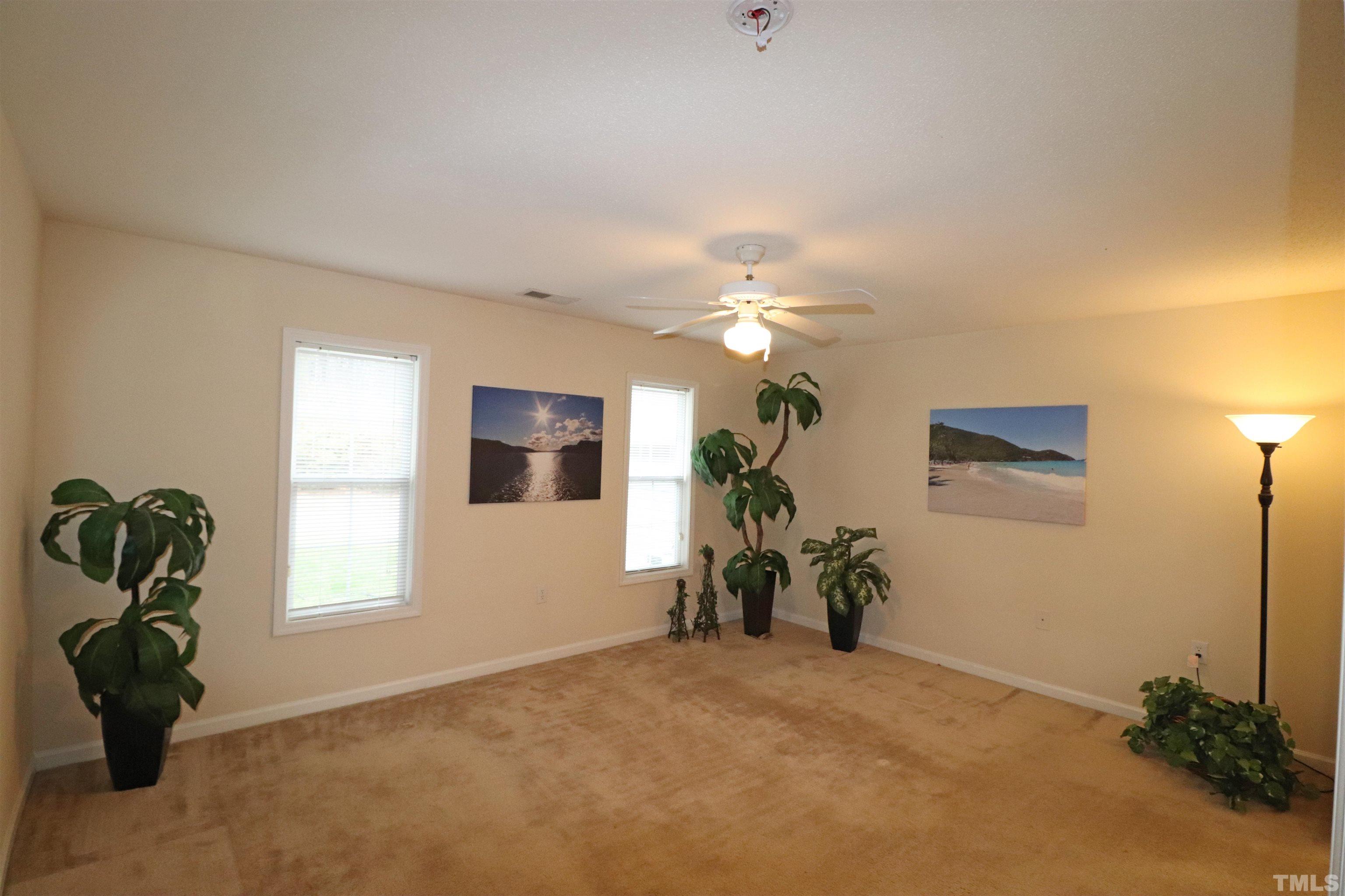 11301 Clubhaven Place, Unit 102 Raleigh, NC 27617 - Photo 34 of 53 a view of a livingroom with furniture and a window